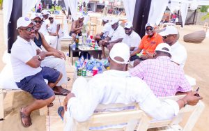 People having fun moments at Mr Biodun Awosika's 60th birthday beach party.